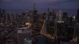 4.8K aerial stock footage of approaching bridges over the Chicago River and skyscrapers, Downtown Chicago, Illinois, twilight Aerial Stock Footage | AX0003_116
