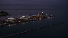4.8K aerial stock footage of flying by Navy Pier at twilight in Chicago, Illinois Aerial Stock Footage | AX0003_123