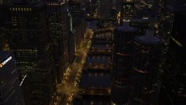 4.8K aerial stock footage follow the Chicago River over bridges and tilt up, Downtown Chicago, Illinois, twilight Aerial Stock Footage | AX0003_135