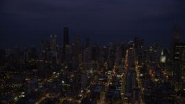 4.8K aerial stock footage of Downtown Chicago skyscrapers and high-rises at night, Illinois Aerial Stock Footage | AX0003_138