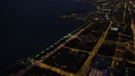 4.8K aerial stock footage of approaching Buckingham Fountain in Grant Park, Downtown Chicago, Illinois, night Aerial Stock Footage | AX0003_146