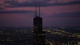 4.8K aerial stock footage of orbiting the top of Willis Tower, on a cloudy day at night, Downtown Chicago, Illinois Aerial Stock Footage | AX0003_149
