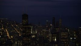 4.8K aerial stock footage of flying by Willis Tower and Downtown Chicago cityscape, Illinois, night Aerial Stock Footage | AX0003_152