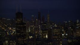 4.8K aerial stock footage approach Downtown Chicago skyscrapers and Willis Tower at night, Illinois Aerial Stock Footage | AX0003_153