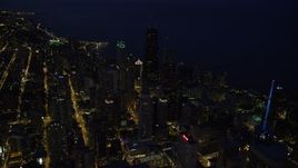 4.8K aerial stock footage of flying over Downtown Chicago toward John Hancock Center, at night, Illinois Aerial Stock Footage | AX0003_157