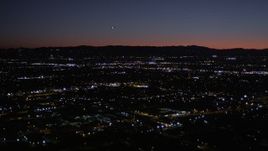 5K aerial stock footage of flying over Van Nuys suburban neighborhoods at night, California Aerial Stock Footage | AX0004_003