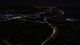 5K aerial stock footage fly over Interstate 170 at night through Universal City, California Aerial Stock Footage | AX0004_006