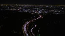 5K aerial stock footage of following Highway 101 at night toward Hollywood, California Aerial Stock Footage | AX0004_010E