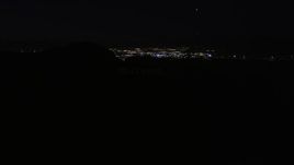 5K aerial stock footage orbit radio tower atop the Hollywood Hills at night, California Aerial Stock Footage | AX0004_012E