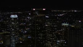 5K aerial stock footage approach and fly over Aon Center at night in Downtown Los Angeles, California Aerial Stock Footage | AX0004_029