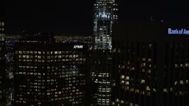 5K stock footage video approach skyscrapers at night in Downtown Los Angeles, California Aerial Stock Footage | AX0004_040E