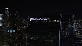 5K aerial stock footage orbit Staples Center and The Ritz-Carlton at night in Downtown Los Angeles, California Aerial Stock Footage | AX0004_043E