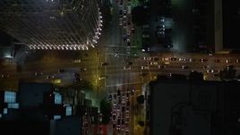 5K aerial stock footage bird's eye view of South Figueroa Street at night in Downtown Los Angeles, California Aerial Stock Footage | AX0004_046E