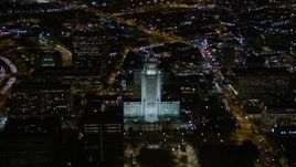 5K aerial stock footage orbit of Los Angeles City Hall at night in Downtown Los Angeles, California Aerial Stock Footage | AX0004_051