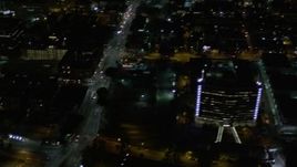 5K aerial stock footage pan across streets and skyscrapers at night in Downtown Los Angeles, California Aerial Stock Footage | AX0004_055