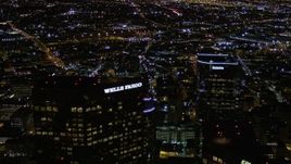 5K aerial stock footage top of Wells Fargo Center at night in Downtown Los Angeles, California Aerial Stock Footage | AX0004_057