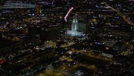 5K aerial stock footage flyby US Bank Tower and approach Wells Fargo Center at night in Downtown Los Angeles, California Aerial Stock Footage | AX0004_060E