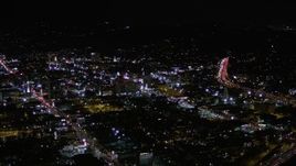 5K aerial stock footage orbit buildings between Sunset and Hollywood Boulevard at night, California Aerial Stock Footage | AX0004_072E