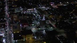 5K aerial stock footage approach Capitol Records Building at night in Hollywood, California Aerial Stock Footage | AX0004_074E