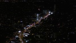 5K aerial stock footage of flying over the Sunset Strip in West Hollywood at nighttime, California Aerial Stock Footage | AX0004_082E