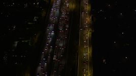 5K aerial stock footage of rush hour traffic at night in Brentwood, California Aerial Stock Footage | AX0004_094E