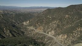 5K aerial stock footage of following Little Tujunga Canyon Road and fly over ridge in San Gabriel Mountains, California Aerial Stock Footage | AX0005_006E