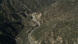 5K aerial stock footage follow a winding road through San Gabriel Mountains, California Aerial Stock Footage | AX0005_008