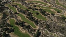 5K aerial stock footage of orbiting a golf course in Canyon Country, California Aerial Stock Footage | AX0005_012E