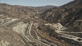 5K aerial stock footage follow road to a tunnel through mountain in the San Gabriel Mountains, California  Aerial Stock Footage | AX0005_018