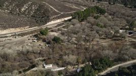 5K aerial stock footage of railroad tracks and dry vegetation in Santa Clarita, California Aerial Stock Footage | AX0005_023