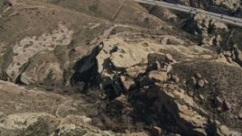 5K aerial stock footage of Mojave Desert rock formations in California Aerial Stock Footage | AX0005_043