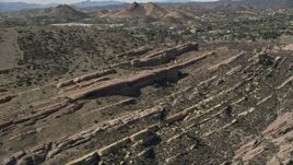 5K aerial stock footage of layers of desert rock formations at Vasquez Rocks Park, California Aerial Stock Footage | AX0005_044