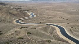 5K aerial stock footage approach an aqueduct in the Mojave Desert of California Aerial Stock Footage | AX0005_059E