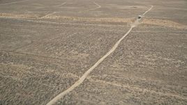 5K aerial stock footage orbit dirt road in the desert in Antelope Valley, California Aerial Stock Footage | AX0005_066