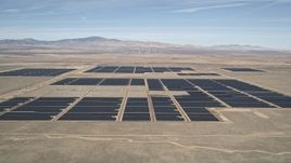 5K aerial stock footage approach Mojave Desert solar energy array in California Aerial Stock Footage | AX0005_103