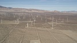 5K aerial stock footage approach a field of windmills in the Mojave Desert, California Aerial Stock Footage | AX0005_124