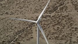 5K aerial stock footage orbit single windmill in the Mojave Desert, California Aerial Stock Footage | AX0005_126E
