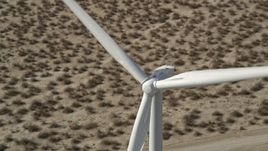 5K aerial stock footage of flying over the top of a windmill in the California, Mojave Desert Aerial Stock Footage | AX0005_133