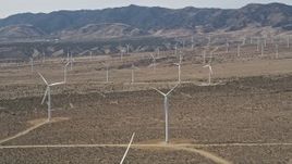 5K aerial stock footage orbit a large group of windmills in the Mojave Desert of California Aerial Stock Footage | AX0005_143