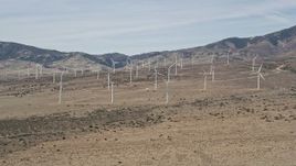 5K aerial stock footage approach wind farm windmills in the desert of Antelope Valley, California Aerial Stock Footage | AX0005_144