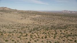 5K aerial stock footage of flying low over open desert in Antelope Valley, California Aerial Stock Footage | AX0005_147