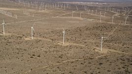 5K aerial stock footage approach three windmills at a wind farm in the California desert Aerial Stock Footage | AX0006_044