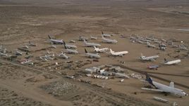 5K aerial stock footage of airplanes and components at an aircraft boneyard, Mojave Air and Space Port, California Aerial Stock Footage | AX0006_086
