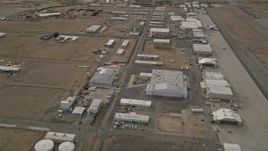 5K aerial stock footage orbit hangars and runways at the Mojave Air and Space Port in California Aerial Stock Footage | AX0006_091