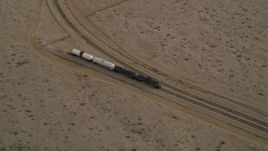 5K aerial stock footage approach tanker train on a side track in Mojave, California Aerial Stock Footage | AX0006_097
