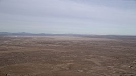 5K aerial stock footage of Edward Air Force Base and dry lake in the Mojave Desert, California Aerial Stock Footage | AX0006_109