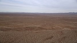 5K aerial stock footage pan for a wide view of the open desert, Mojave Desert, California Aerial Stock Footage | AX0006_147E