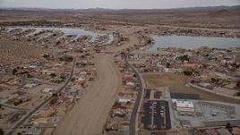 5K aerial stock footage fly over small desert town with two lakes in Helendale, California Aerial Stock Footage | AX0006_164E