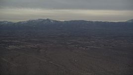 5K aerial stock footage of Background VFX Plate of Mojave Desert and mountains with snow at Sunset, California Aerial Stock Footage | AX0007_020