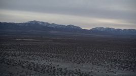 5K aerial stock footage of VFX Plate of Mojave Desert and mountains with snow at twilight, California Aerial Stock Footage | AX0007_030